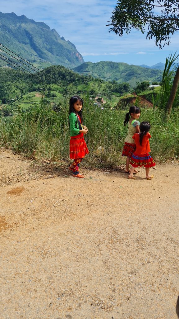 Picture of Vietnamese little girls while motorbiking in Vietnam