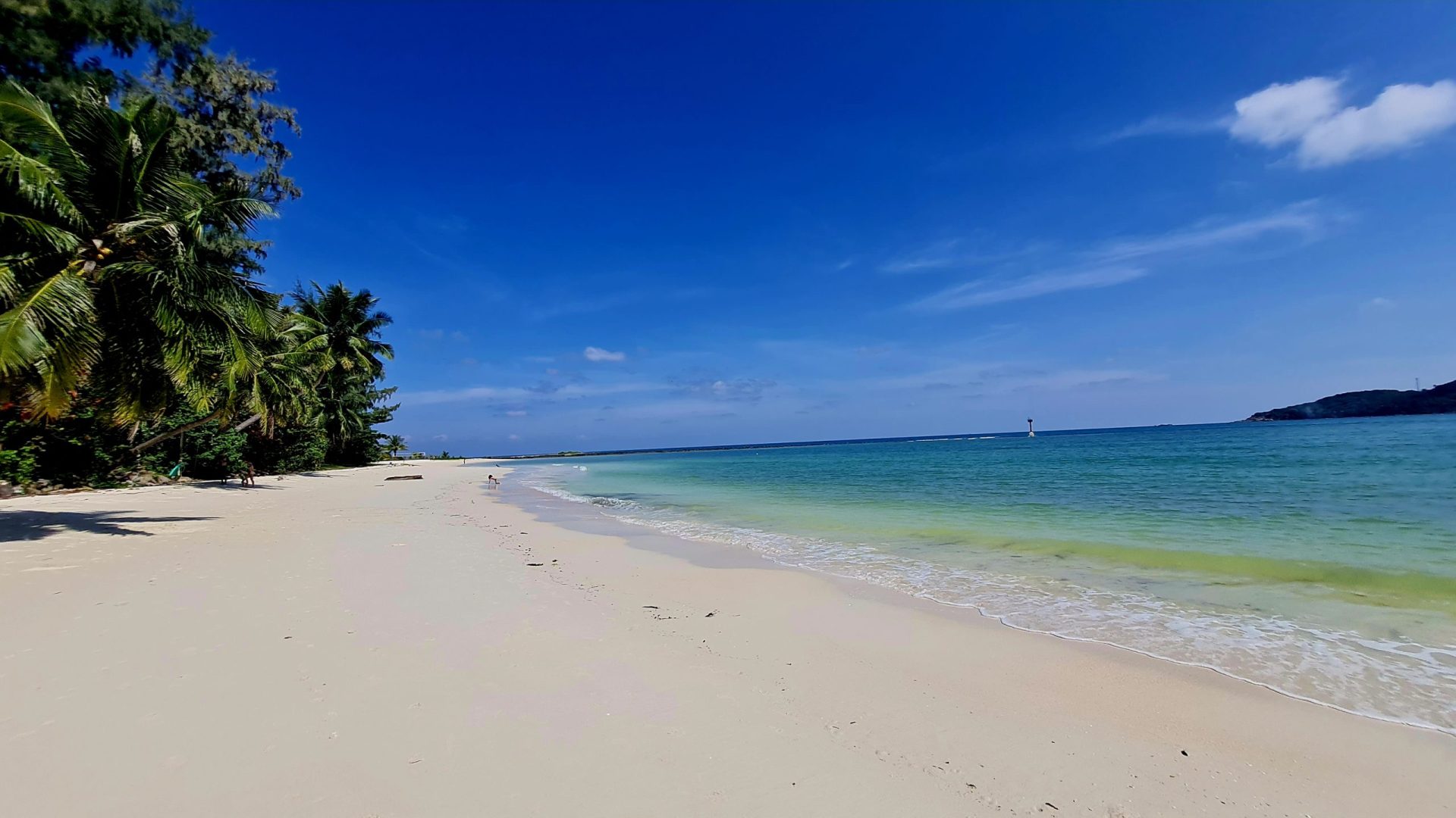 Empty beach, travel off peak season to save money