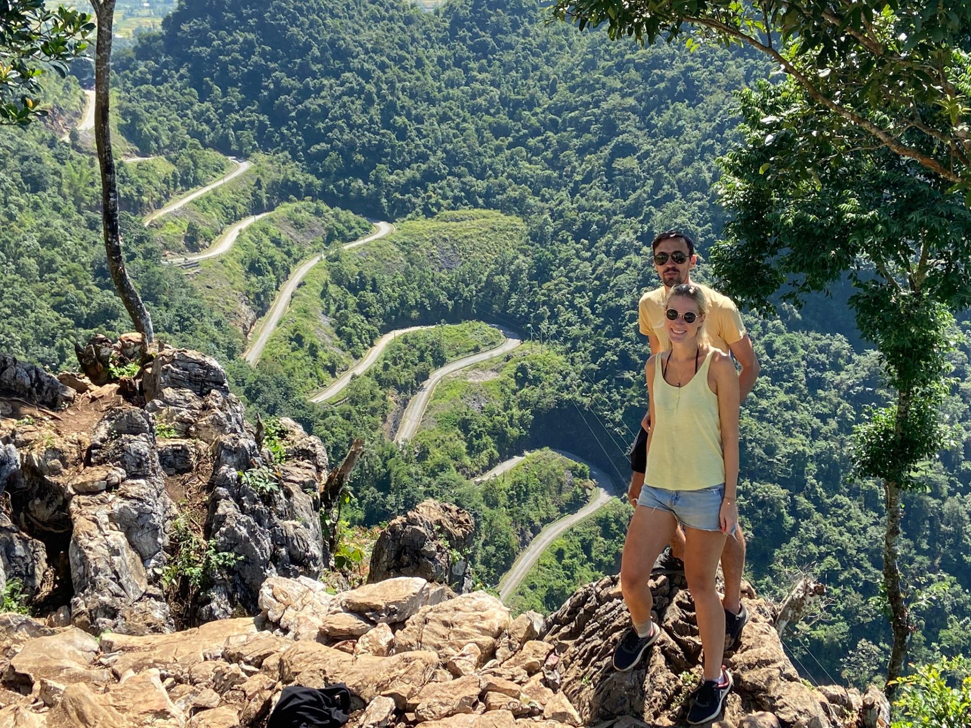 Motorbiking in Vietnam, Picture of two people and beautiful landscape in back