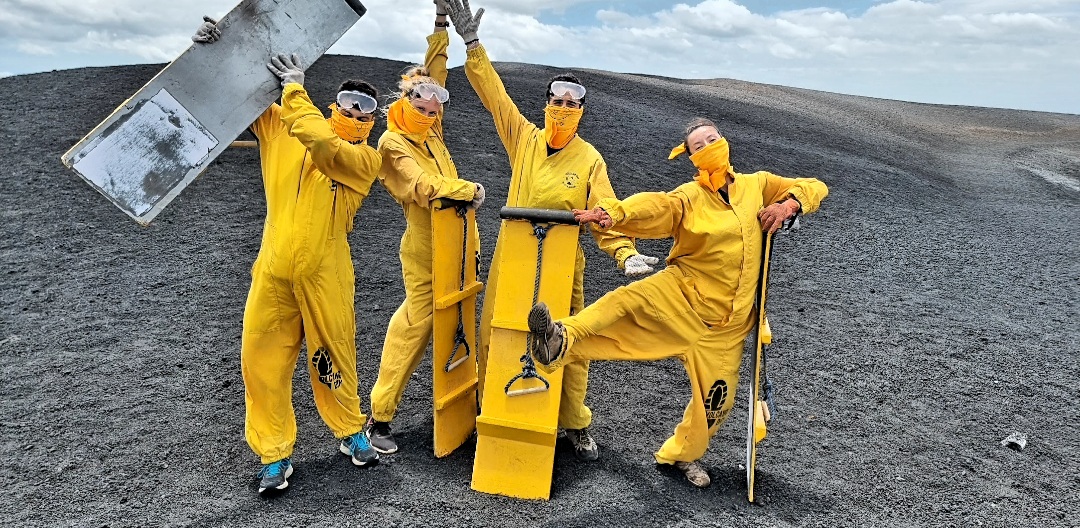 A group of people volcano Boarding in Nicaragua