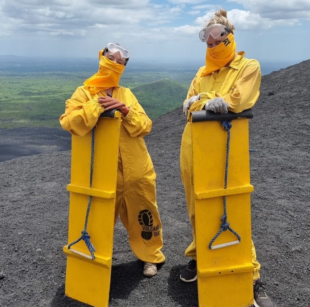 Volcano Boarding - 2 girls holding their boards on Cerro Negro