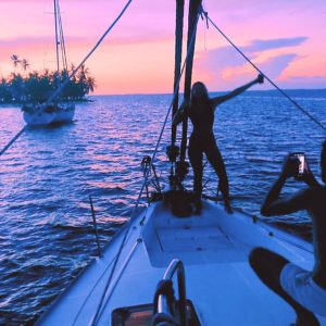 Social media and travel trends: a man taking a picture of a girl on a boat
